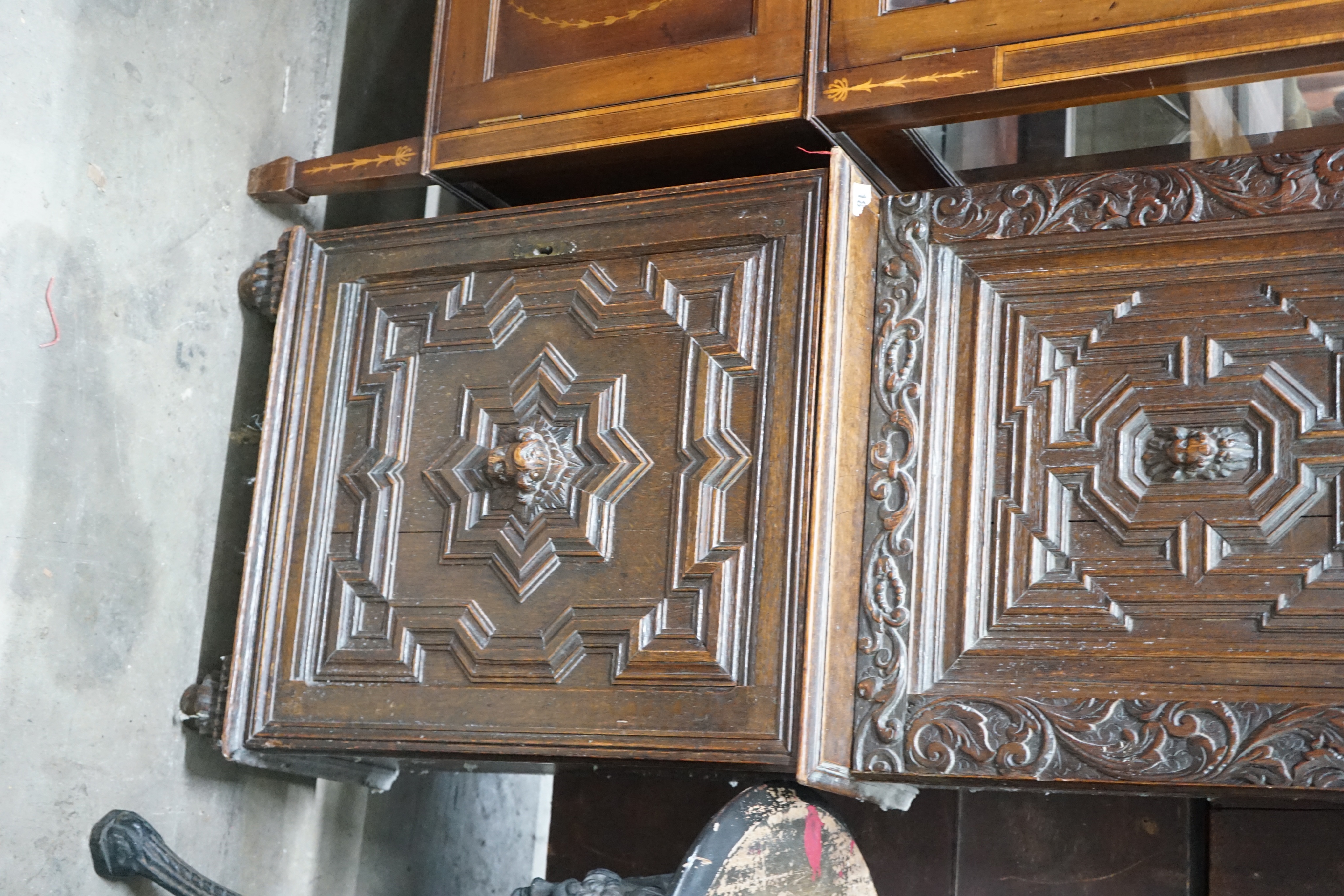 A carved oak narrow cupboard, width 60cm depth 28cm height 176cm